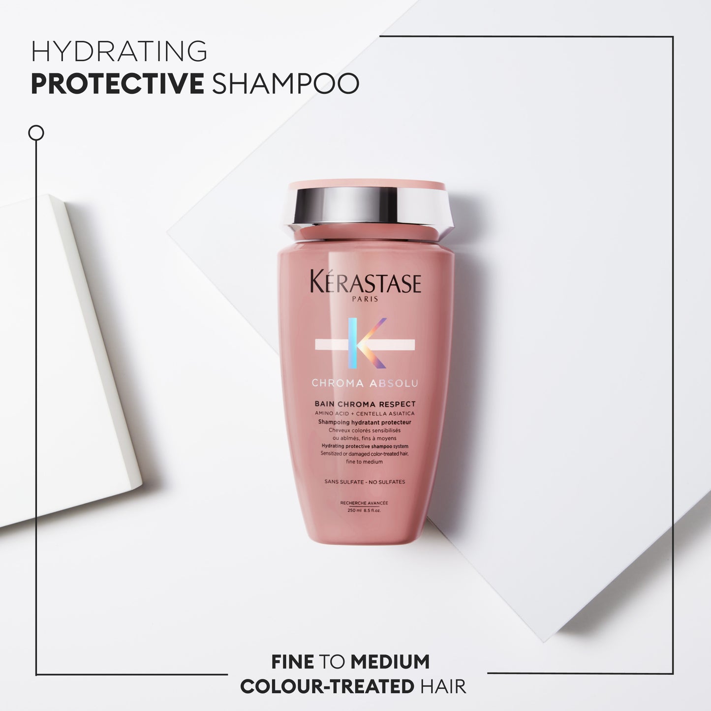 A bottle of Kerestase Chroma Absolu Bain Chroma Respect 250ml is elegantly displayed on a white geometric background. The label emphasizes its hydrating and protective benefits for fine to medium, color-treated hair. I'm sorry, but the product description appears to be incomplete or malformed.