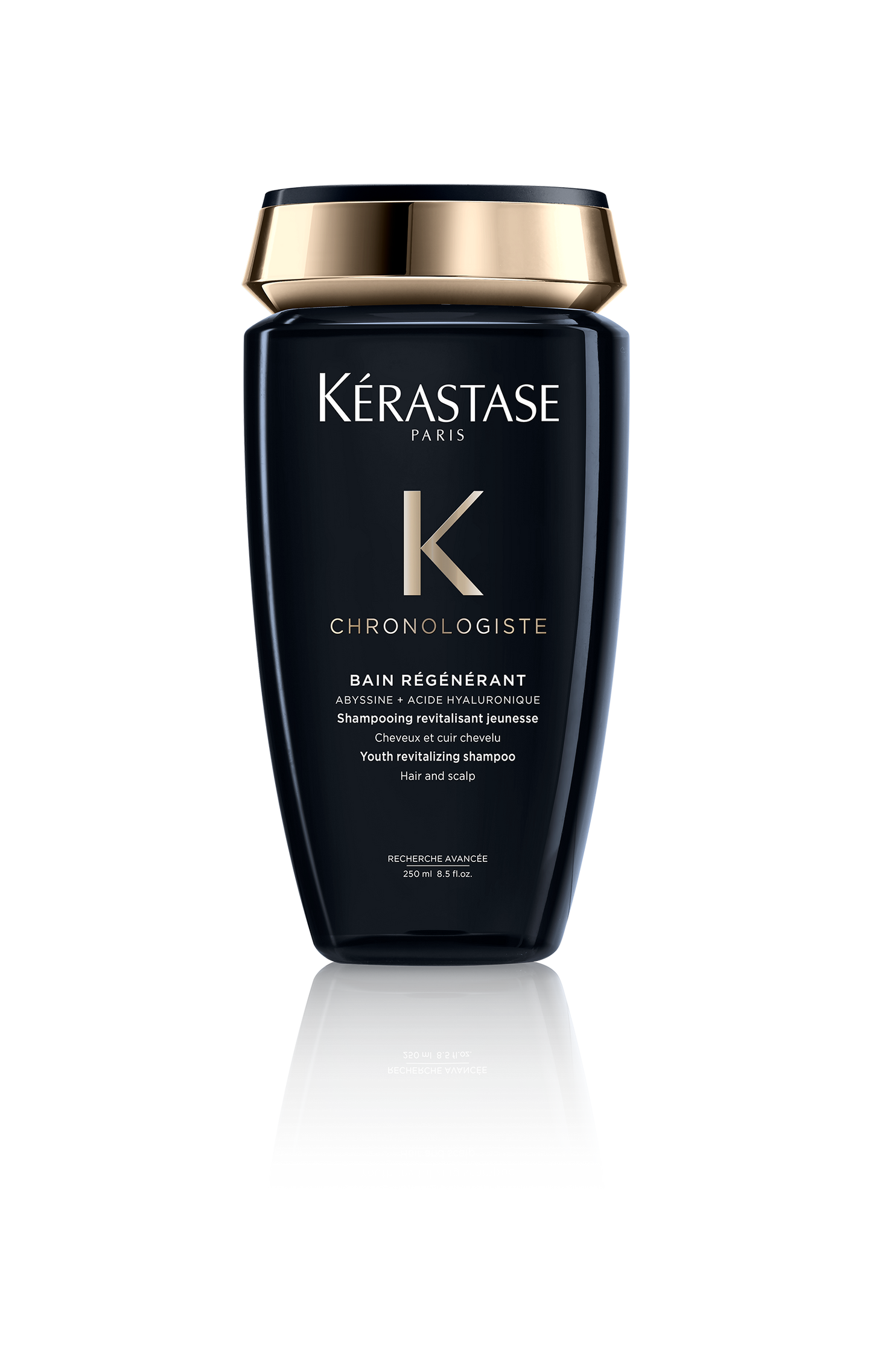 The Chronologiste Bain Régénérant 250ml from Kerastase is elegantly designed with a sleek black bottle and a gold cap. The label highlights its youth revitalizing formula for hair and scalp, making it a luxurious addition to any beauty routine.