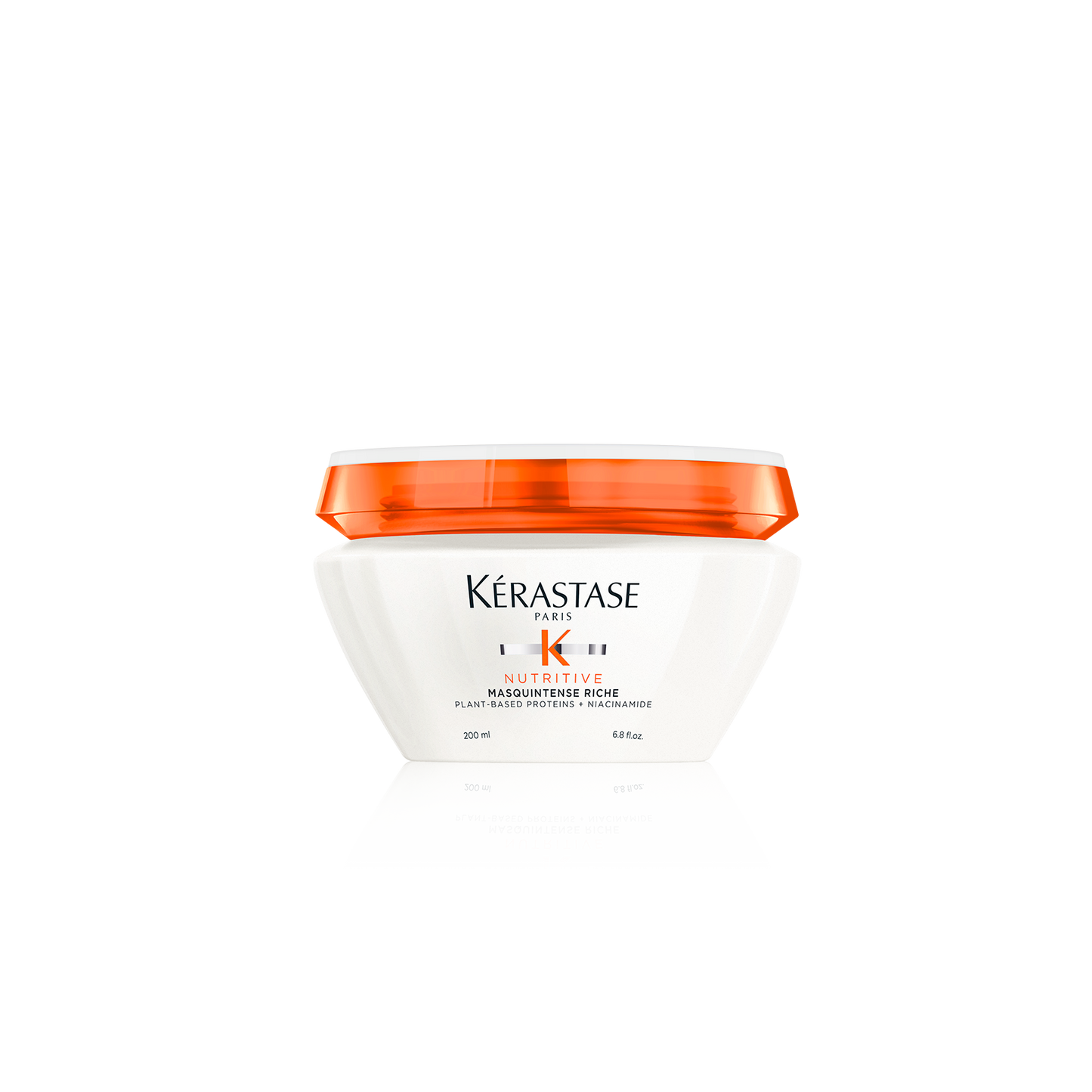 A white jar of Kerestase Nutrive Mask Intense Medium Hair, equipped with an orange lid, is designed for thick, dry hair. The label elegantly displays brand and product details in black and gold text.