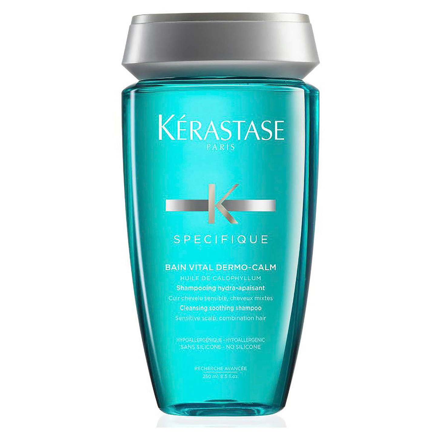 The blue bottle of Kerestase Specifique Bain Vital Dermo-Calm 250ml shampoo features a sleek silver cap and prominently showcases the brand and product name on the front.