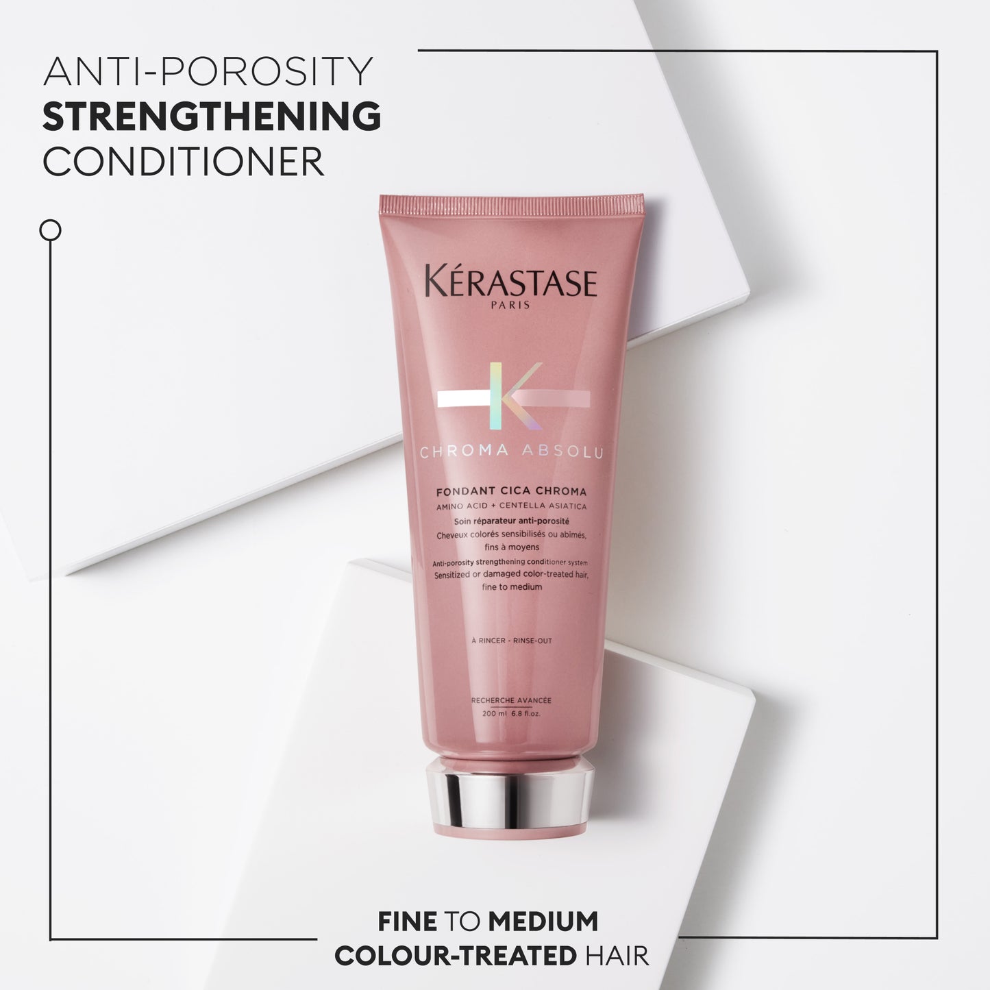 A pink tube of Kerastase Chroma Absolu Fondant Cica Chroma 200ml conditioner sits on a white surface, highlighting its anti-porosity formula. Ideal for fine to medium, color-treated hair, this strengthening conditioner ensures vibrant results.